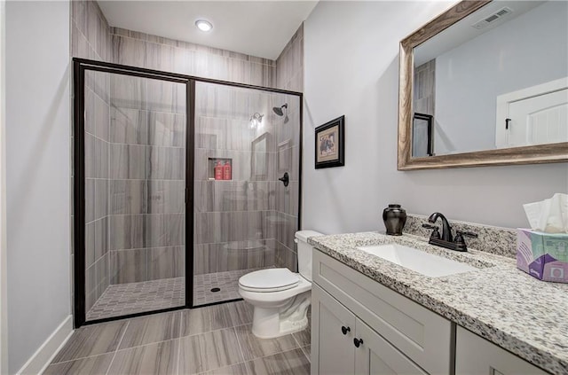 full bath with visible vents, a stall shower, toilet, and vanity