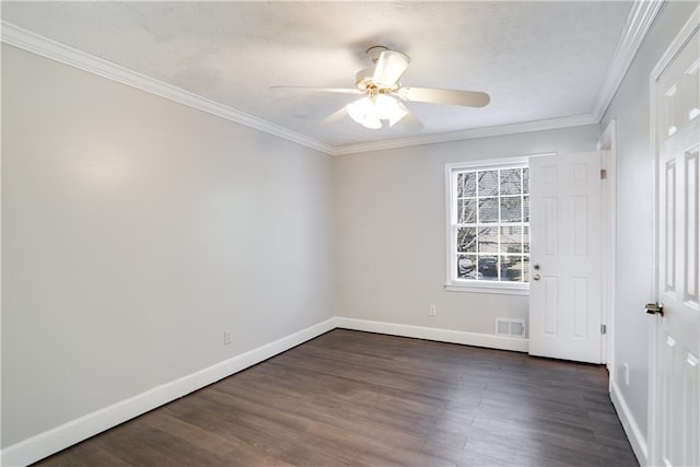 unfurnished room featuring ornamental molding, ceiling fan, and dark wood-type flooring