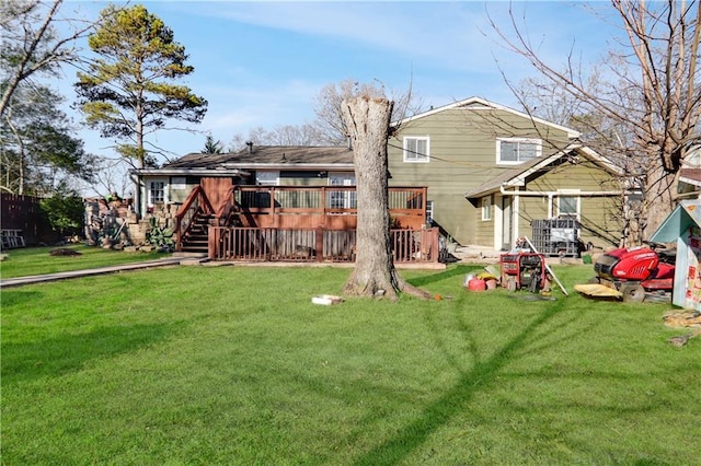 back of house with a yard and a wooden deck