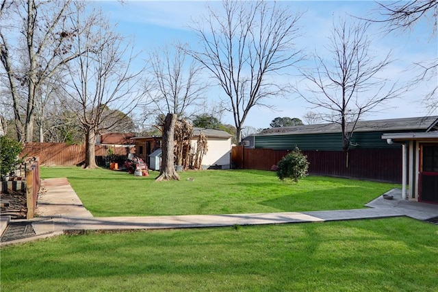 view of yard with a storage shed