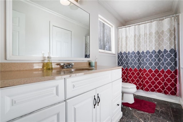 bathroom with toilet, ornamental molding, and vanity