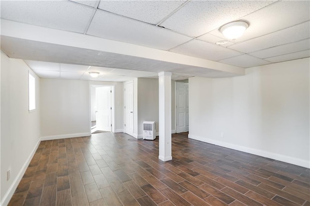 basement featuring a paneled ceiling