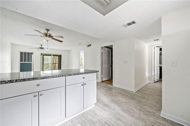 66 Fair Haven Way SE, Smyrna, GA 30080 - entryway featuring a textured ceiling, baseboards, and light wood-type flooring