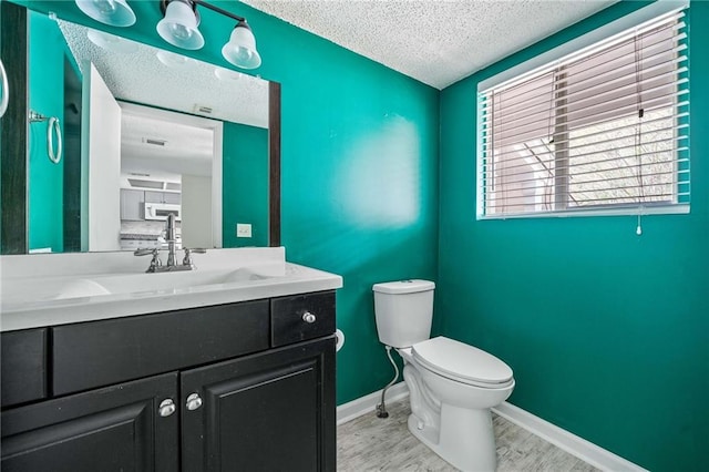 66 Fair Haven Way SE, Smyrna, GA 30080 - unfurnished living room with ceiling fan, a textured ceiling, baseboards, a fireplace with flush hearth, and wood finished floors
