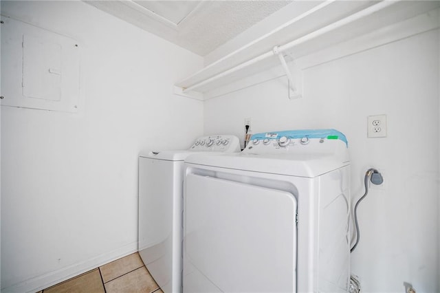 66 Fair Haven Way SE, Smyrna, GA 30080 - laundry room featuring washing machine and clothes dryer, light tile patterned flooring, and laundry area