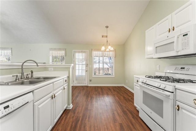 kitchen featuring white cabinetry, sink, and white appliances