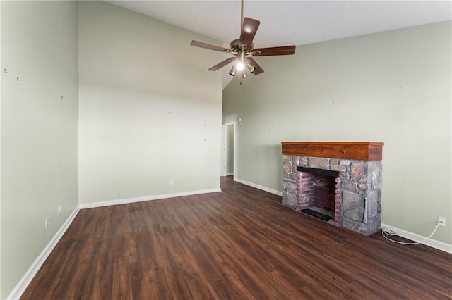 unfurnished living room featuring ceiling fan, a stone fireplace, high vaulted ceiling, and dark hardwood / wood-style flooring