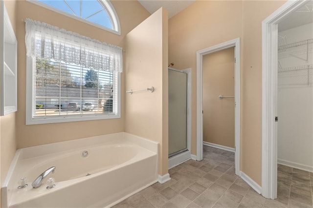 bathroom featuring plus walk in shower