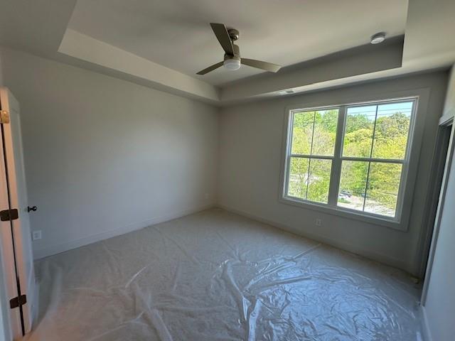 1392 Cozy Cir Unit 349, Atlanta, GA 30315 - unfurnished room featuring a raised ceiling and a ceiling fan