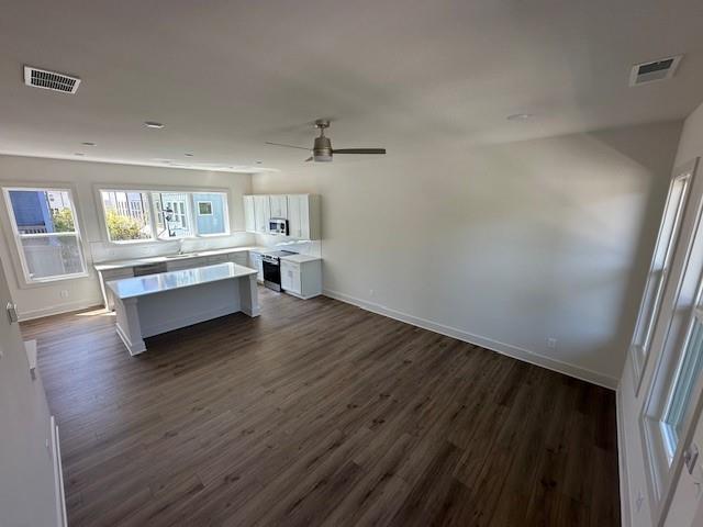 1392 Cozy Cir Unit 349, Atlanta, GA 30315 - kitchen with visible vents, light countertops, and stainless steel electric range