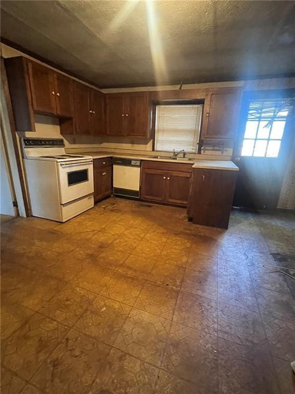 kitchen with white appliances and sink