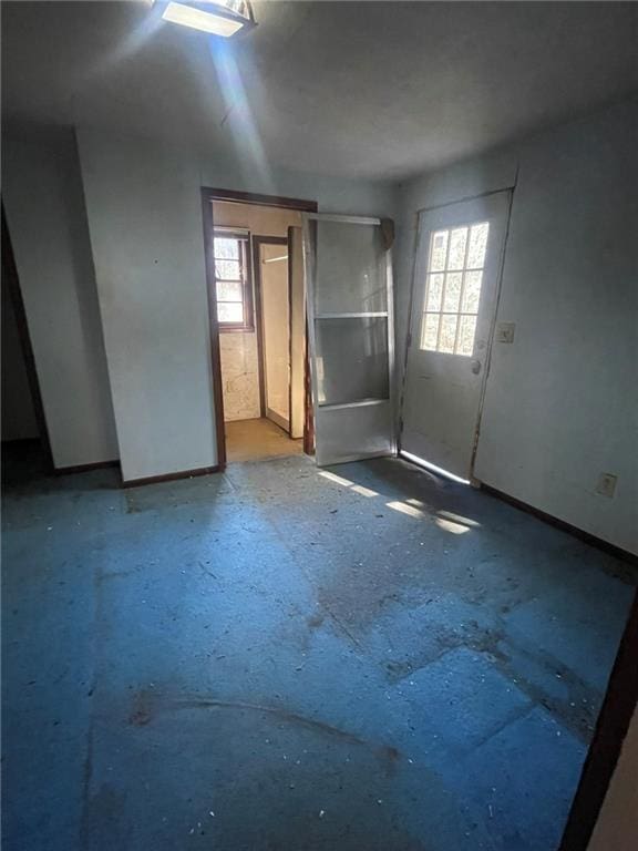 spare room with concrete flooring