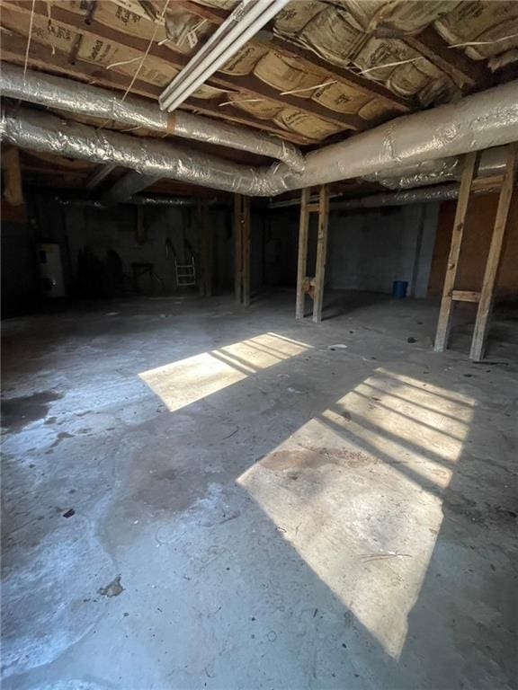 details featuring concrete flooring and water heater