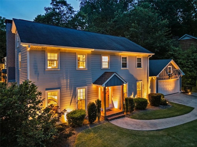 3912 Edenton Ct NE, Brookhaven, GA 30319 - colonial home with concrete driveway, a garage, a front lawn, and a chimney