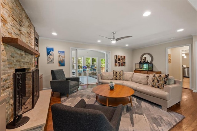 3912 Edenton Ct NE, Brookhaven, GA 30319 - living area with wood finished floors, recessed lighting, a ceiling fan, ornamental molding, and a large fireplace