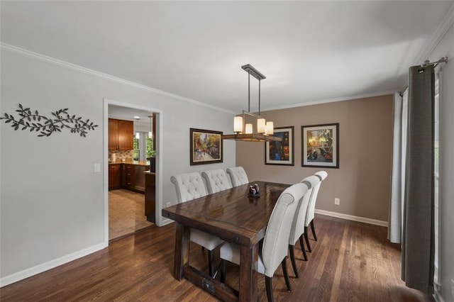 3912 Edenton Ct NE, Brookhaven, GA 30319 - dining room featuring ornamental molding, dark wood finished floors, baseboards, and a chandelier