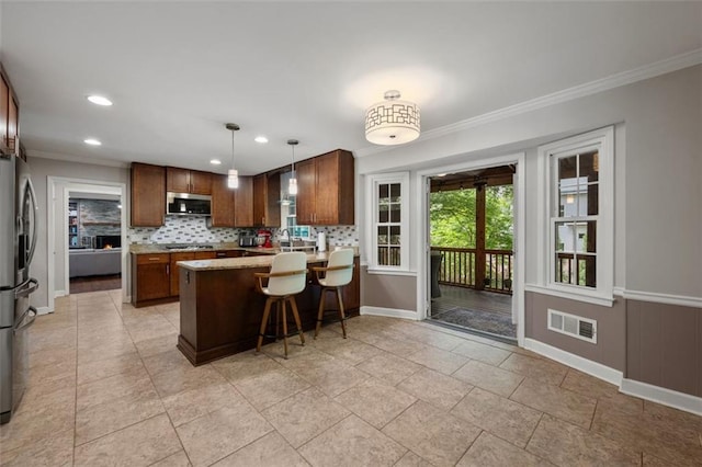 3912 Edenton Ct NE, Brookhaven, GA 30319 - kitchen featuring appliances with stainless steel finishes, baseboards, ornamental molding, a peninsula, and backsplash
