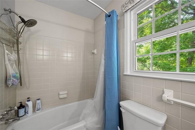 3912 Edenton Ct NE, Brookhaven, GA 30319 - bathroom featuring toilet, shower / tub combo with curtain, and tile walls
