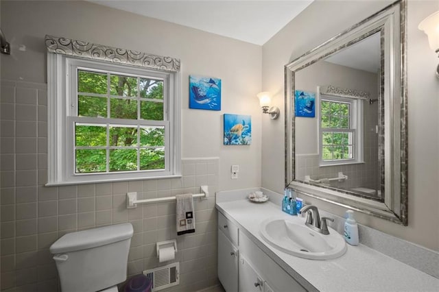 3912 Edenton Ct NE, Brookhaven, GA 30319 - bathroom with toilet, vanity, tile walls, and wainscoting