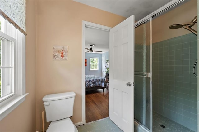3912 Edenton Ct NE, Brookhaven, GA 30319 - ensuite bathroom with a shower stall, toilet, and a ceiling fan