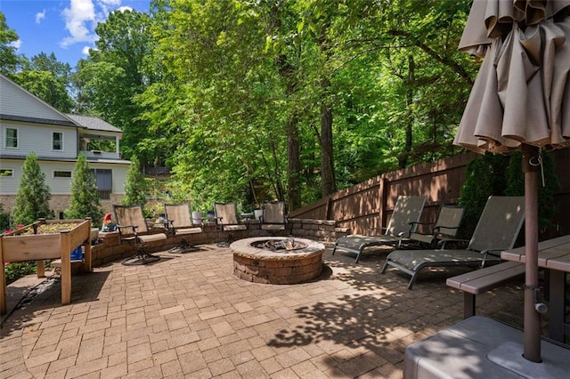 3912 Edenton Ct NE, Brookhaven, GA 30319 - view of patio featuring a fire pit and fence