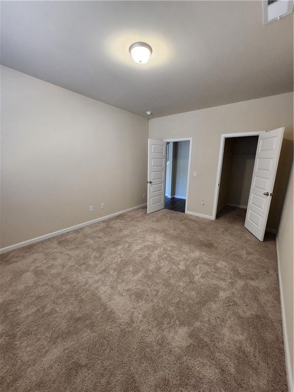 unfurnished bedroom with carpet floors