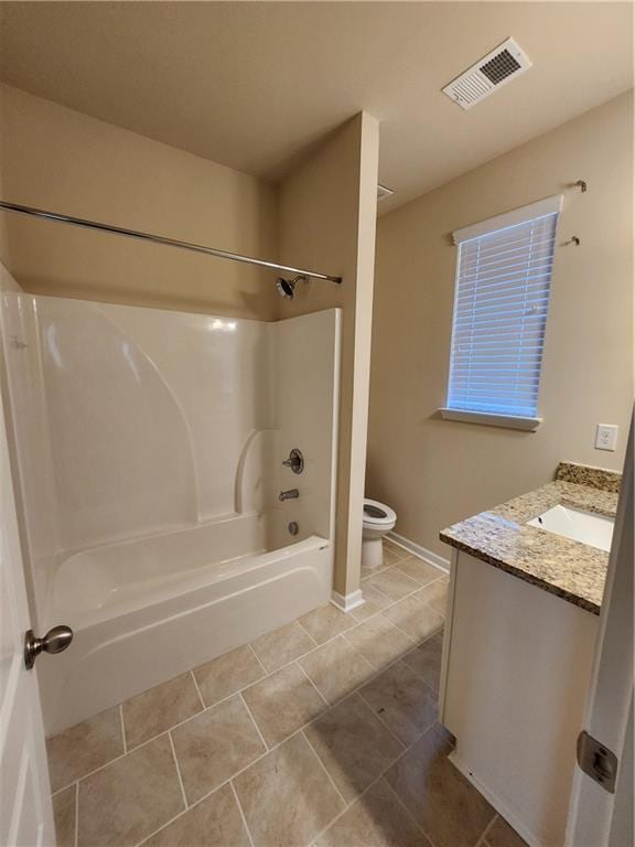 full bathroom with vanity, tile patterned floors, shower / washtub combination, and toilet