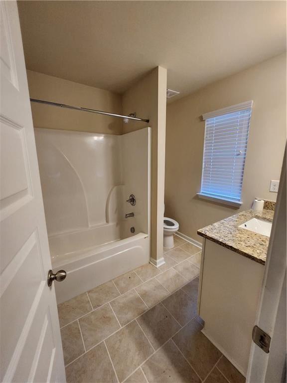 full bathroom featuring tile patterned floors, vanity, toilet, and bathing tub / shower combination