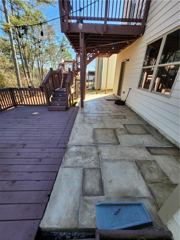 wooden terrace featuring a patio