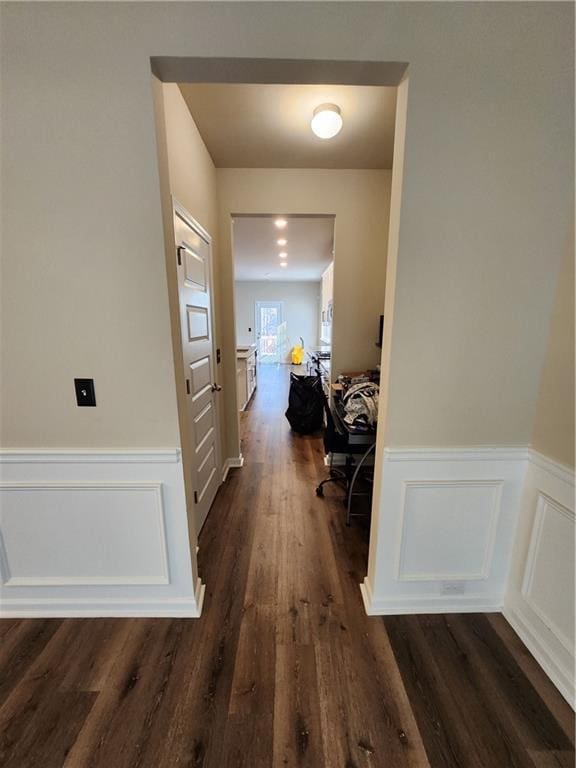 hall with dark hardwood / wood-style floors