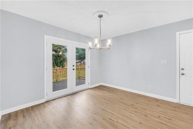 3355 Wesley Chapel Rd, Decatur, GA 30034 - unfurnished room featuring a chandelier, light wood finished floors, french doors, and baseboards