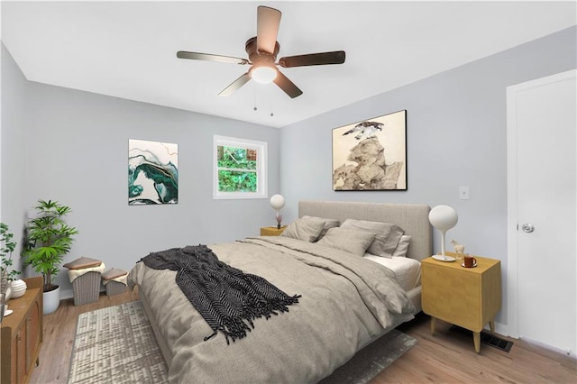 3355 Wesley Chapel Rd, Decatur, GA 30034 - bedroom with light wood-style floors, a ceiling fan, and baseboards