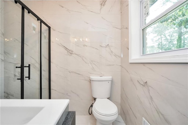 3355 Wesley Chapel Rd, Decatur, GA 30034 - full bathroom with tile walls, plenty of natural light, a marble finish shower, and toilet