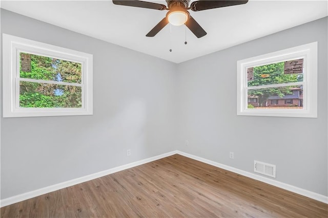 3355 Wesley Chapel Rd, Decatur, GA 30034 - unfurnished room with baseboards, wood finished floors, and a ceiling fan