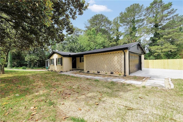 3355 Wesley Chapel Rd, Decatur, GA 30034 - view of front of house featuring an attached garage, driveway, brick siding, and view of scattered trees