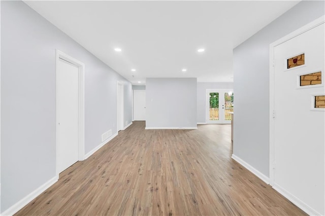 3355 Wesley Chapel Rd, Decatur, GA 30034 - unfurnished living room with light wood-type flooring, recessed lighting, and baseboards