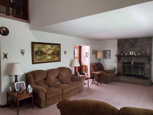 living room featuring carpet floors, a textured ceiling, and a fireplace