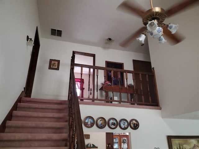 staircase with ceiling fan