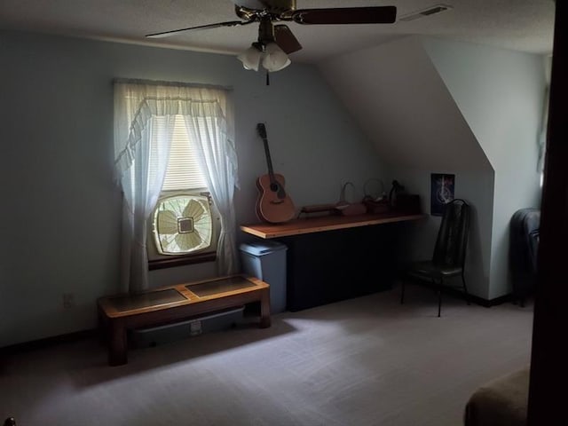 interior space featuring lofted ceiling, carpet floors, and ceiling fan