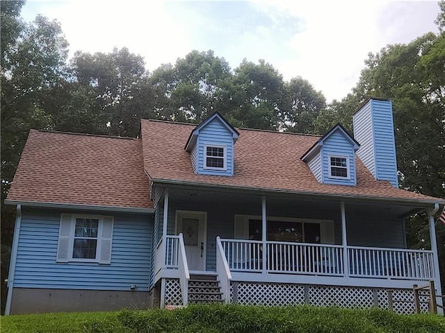 cape cod home with a porch