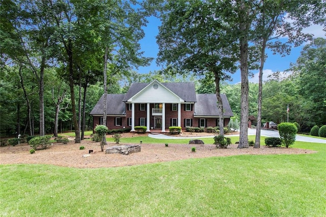 402 Clyde Ct, Mcdonough, GA 30252 - neoclassical home with a front yard and brick siding