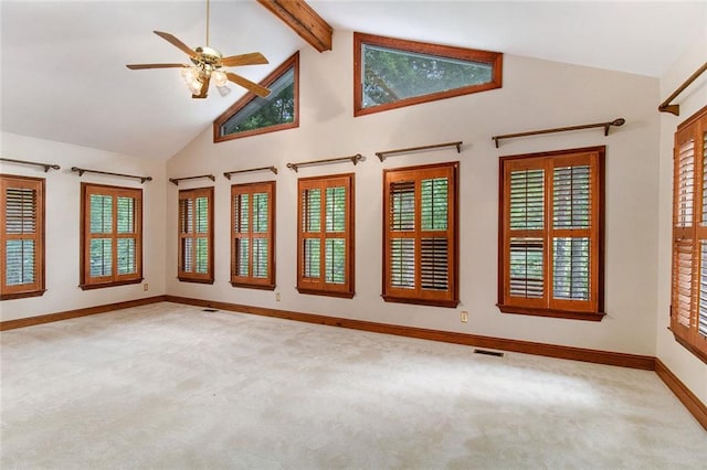 402 Clyde Ct, Mcdonough, GA 30252 - carpeted empty room with high vaulted ceiling, ceiling fan, and beam ceiling