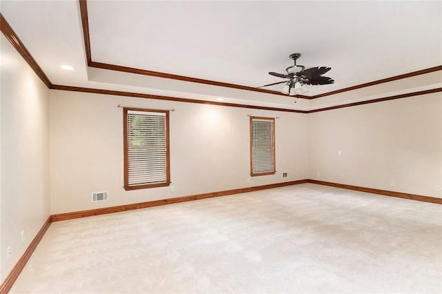402 Clyde Ct, Mcdonough, GA 30252 - empty room featuring a tray ceiling, light carpet, ornamental molding, a ceiling fan, and recessed lighting