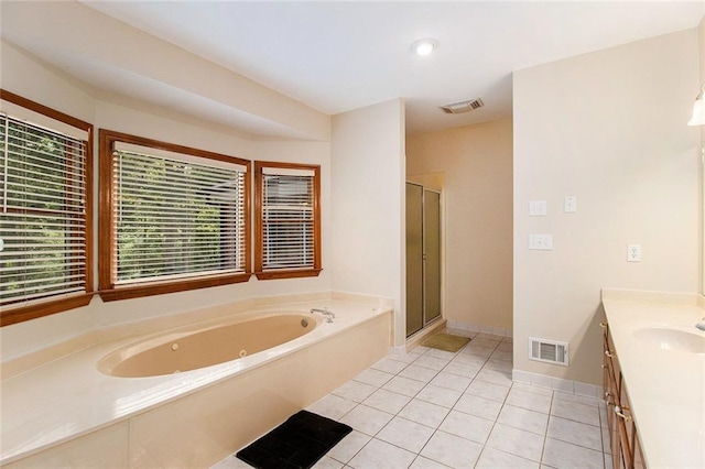 402 Clyde Ct, Mcdonough, GA 30252 - bathroom with a tub with jets, vanity, tile patterned flooring, and a shower stall