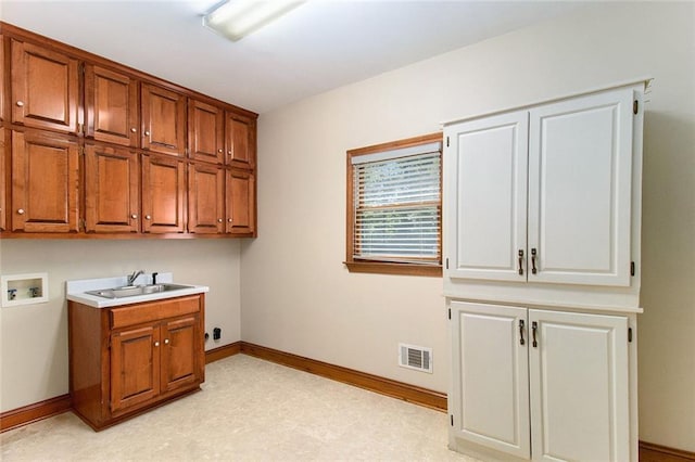 402 Clyde Ct, Mcdonough, GA 30252 - laundry room featuring cabinet space and hookup for a washing machine