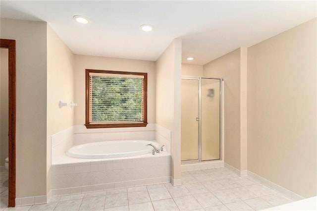 402 Clyde Ct, Mcdonough, GA 30252 - bathroom with a garden tub, a stall shower, tile patterned flooring, and recessed lighting