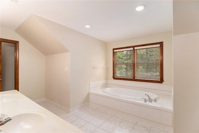 402 Clyde Ct, Mcdonough, GA 30252 - bathroom featuring a bath, tile patterned flooring, double vanity, recessed lighting, and vaulted ceiling