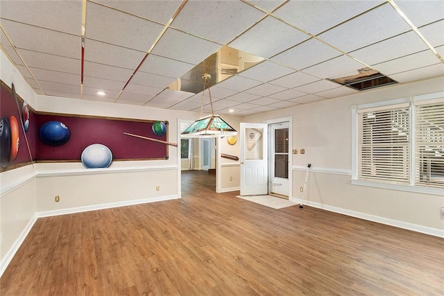 402 Clyde Ct, Mcdonough, GA 30252 - workout area with wood finished floors and a drop ceiling