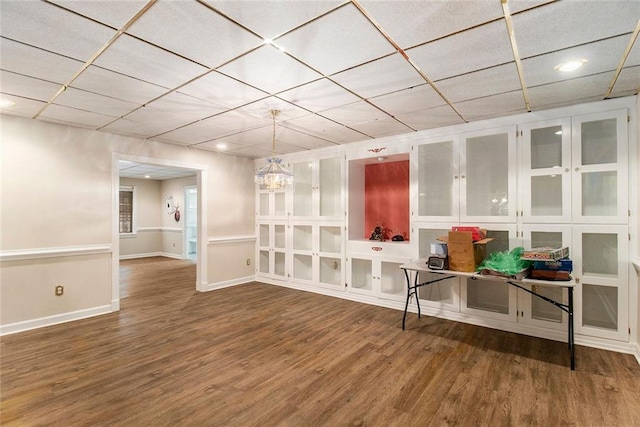 402 Clyde Ct, Mcdonough, GA 30252 - basement featuring wood finished floors, a drop ceiling, and recessed lighting
