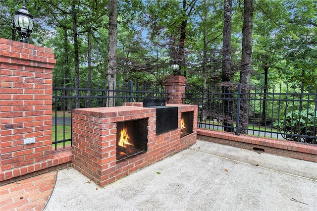 402 Clyde Ct, Mcdonough, GA 30252 - view of patio / terrace featuring an outdoor brick fireplace